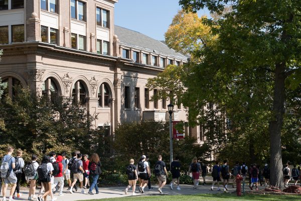 Students walking on a college campus.