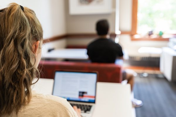 A college student working on a laptop.