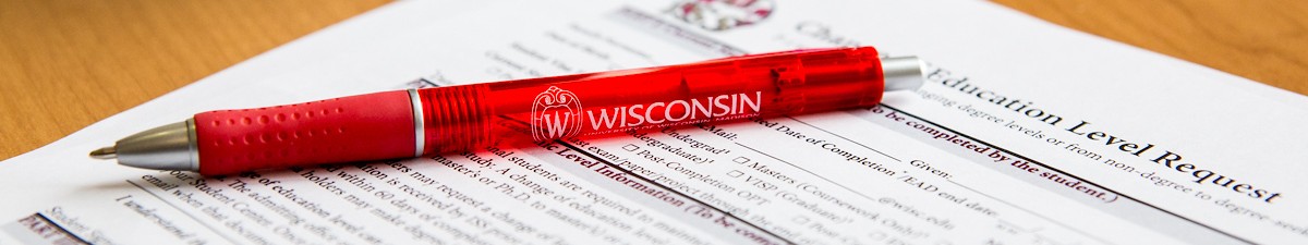 uw pen on piece of paper