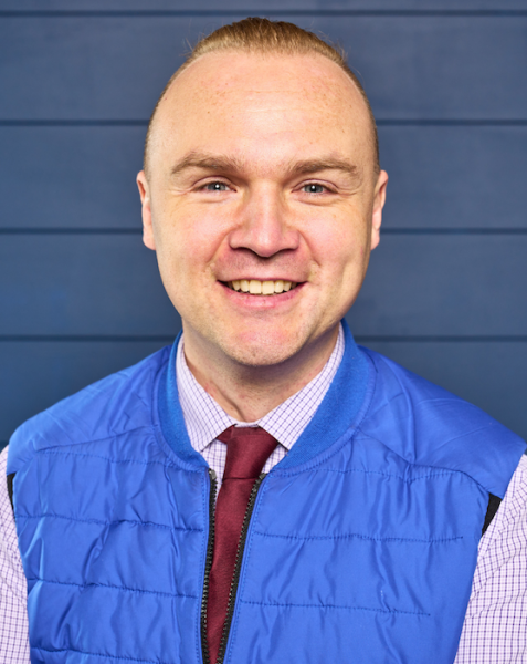 A headshot of Dr. Adam Ross Nelson