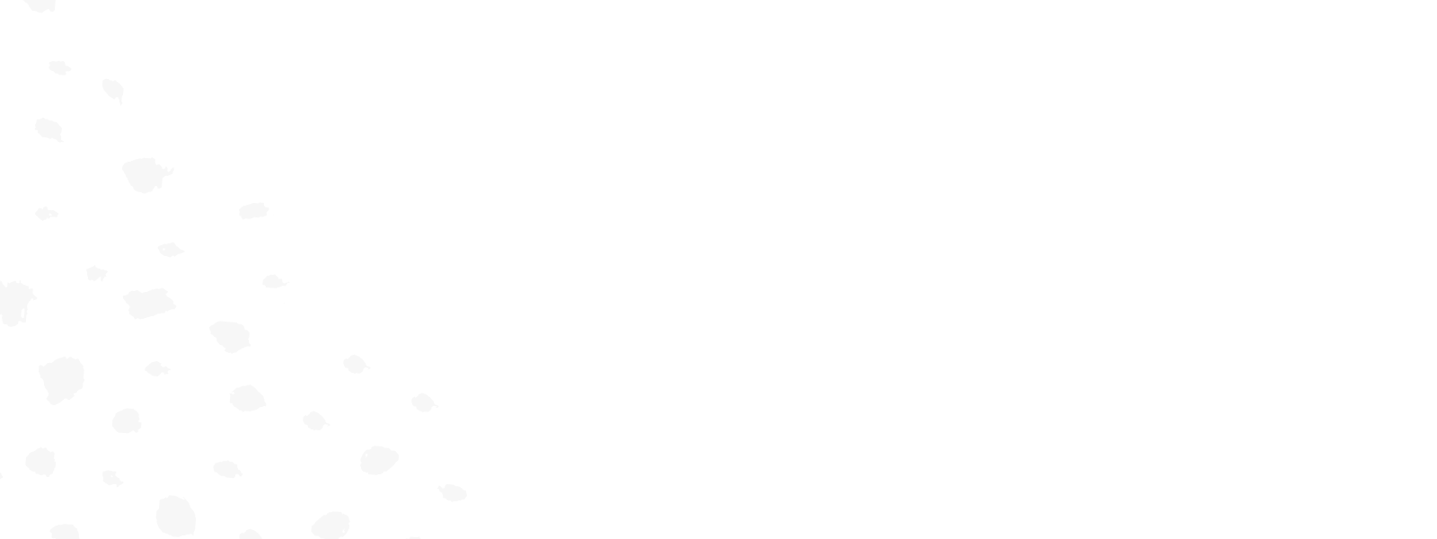 A white decorative background with light gray spots in the bottom left corner.