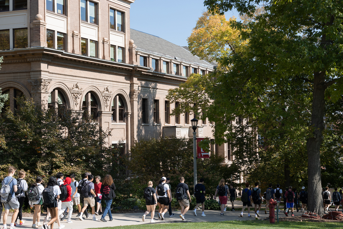 Students walking on a college campus.