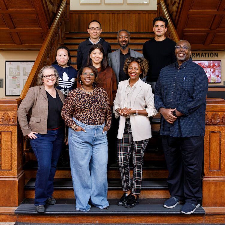 A group photos of the ELPA department Higher Education faculty taken September 2026. The group is standing on the stairs of the School of Education Building.
